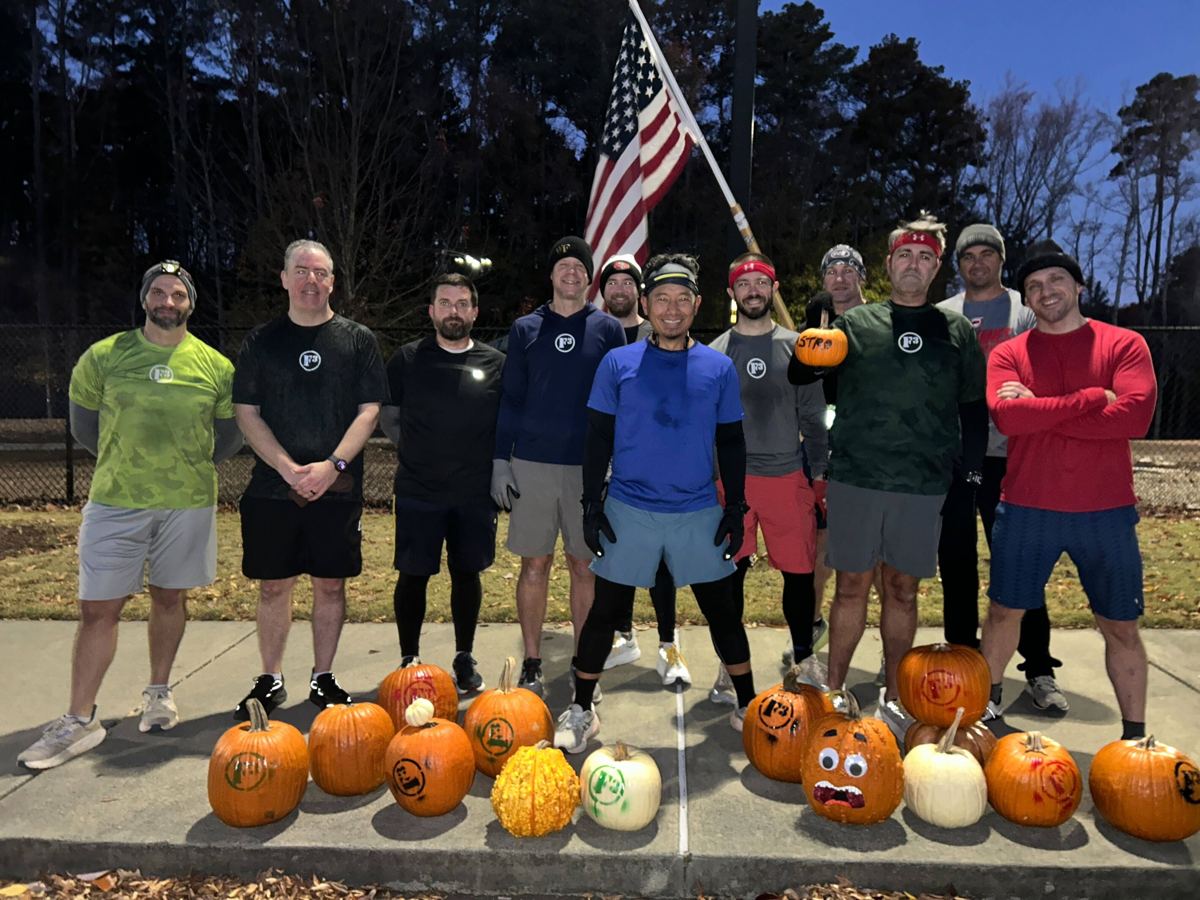 F3 South Cary men lined up behind F3-stenciled pumpkins at dawn